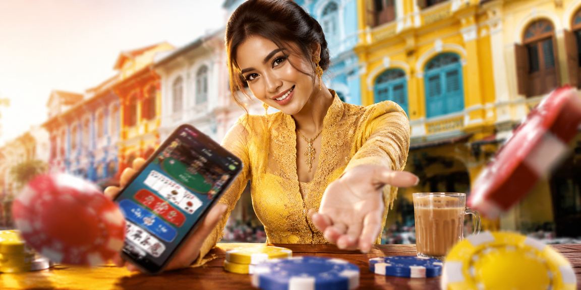 Pengguna Pulau Pinang bermain kasino mudah alih 1more melalui aplikasi Android sambil berbaju kebaya